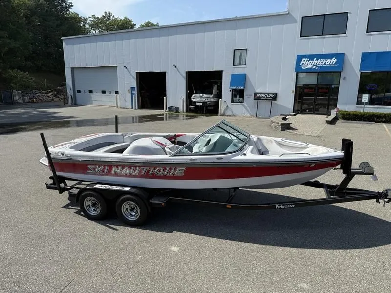 Slide: The Image of 2008 Nautique Ski Nautique 206 boat on trailer outside workshop. - 8