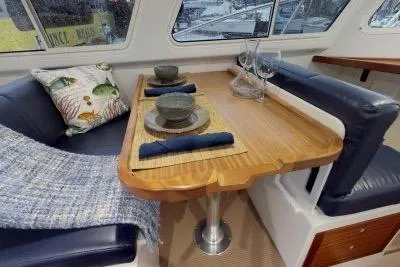 Slide: The Image of Interior of 2018 Ocean Sport 33 Roamer with elegant dining setup and cozy seating. - 10