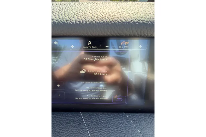 Slide: The Image of 2023 Nautique Super Air Nautique G25 dashboard displaying engine service hours and speed. - 11