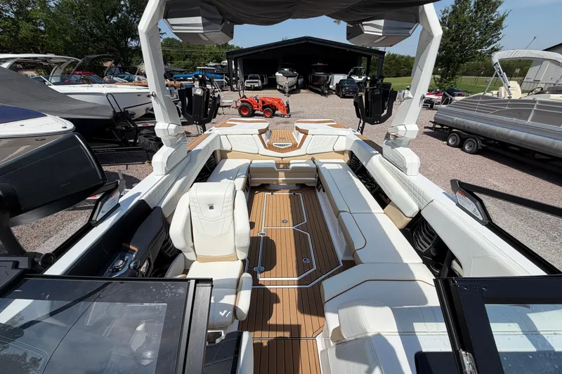 Slide: The Image of 2023 Nautique Super Air Nautique G25 boat interior with luxurious seating and modern design. - 17