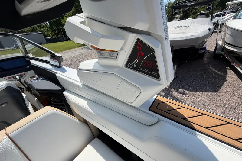 Slide: The Image of 2023 Nautique Super Air Nautique G25 interior with modern seating and control panel. - 21