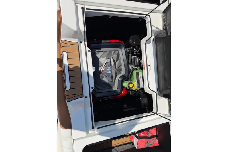 Slide: The Image of 2023 Nautique Super Air Nautique G25 engine compartment, showcasing PCM engine details. - 23