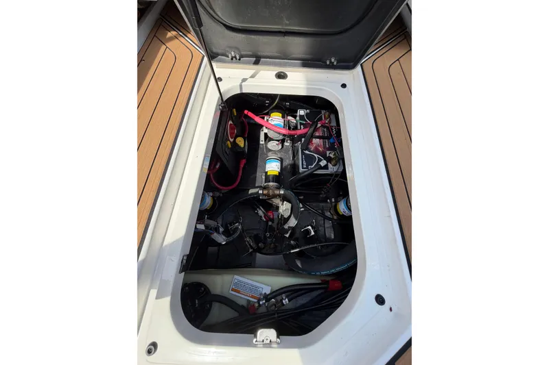 Slide: The Image of 2023 Nautique Super Air Nautique G25 engine compartment with visible components and wiring. - 9