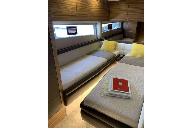 Slide: The Image of Luxurious interior of 2026 Cobrey 52 FLY yacht with twin beds and modern decor. - 9