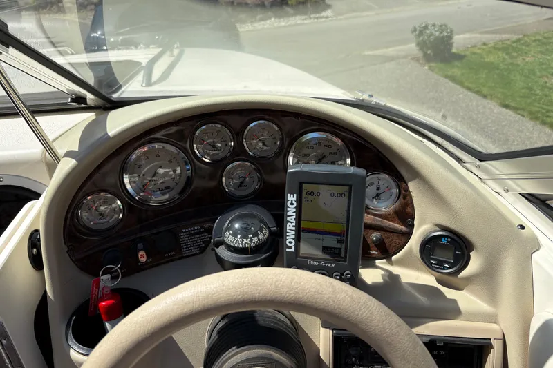 Slide: The Image of Dashboard of a 1997 Stingray 200 CS boat with gauges and Lowrance GPS. - 10