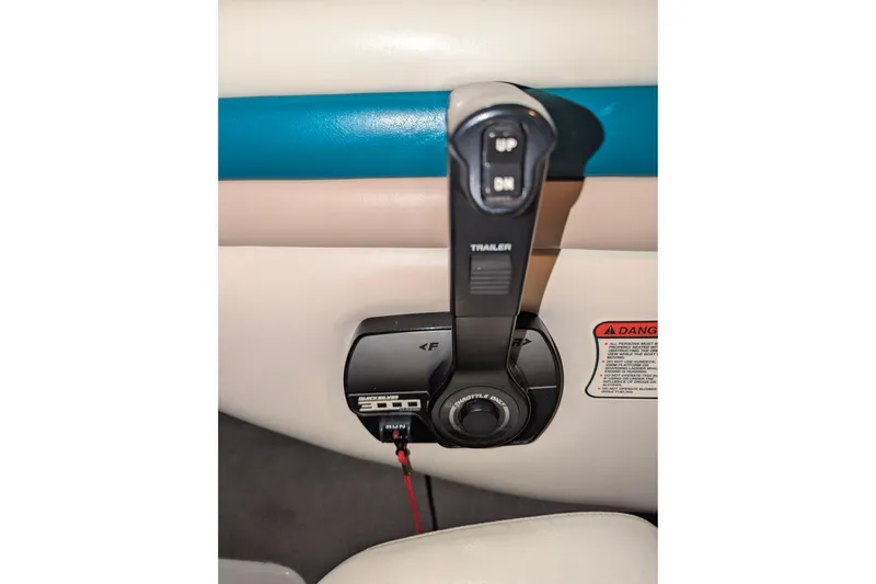 Slide: The Image of Throttle control lever in a 1997 Stingray 200 CS boat interior. - 12