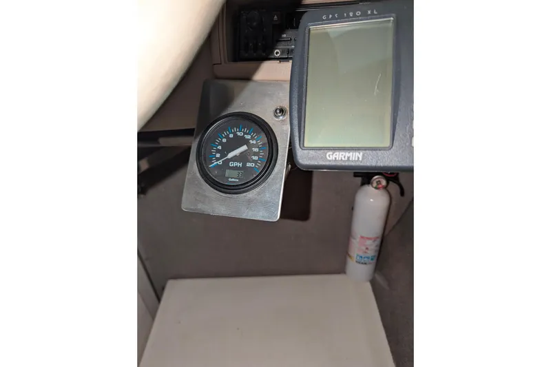 Slide: The Image of 1997 Stingray 200 CS dashboard with Garmin GPS and fuel gauge. - 22