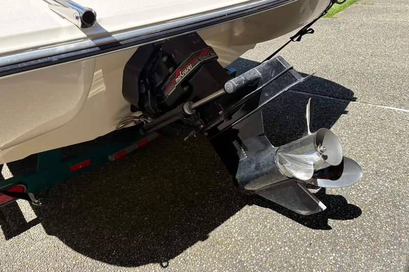 Slide: The Image of 1997 Stingray 200 CS boat with MerCruiser outdrive, parked on a trailer. - 24
