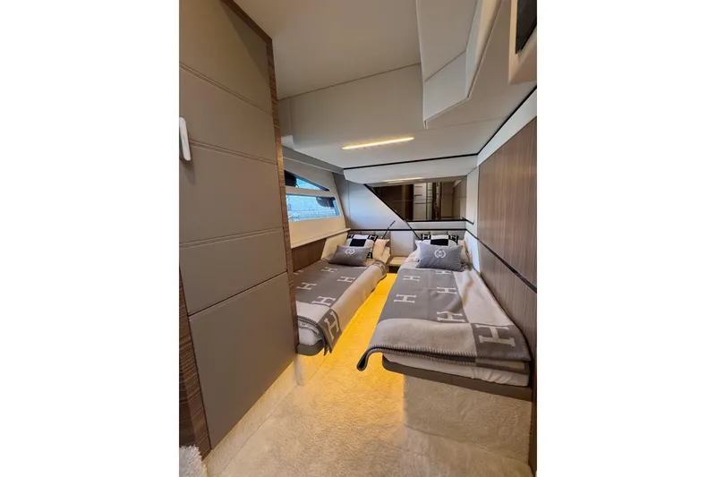 Slide: The Image of Luxurious twin cabin interior of 2026 Cobrey 45 FLY yacht, featuring modern design and cozy bedding. - 20
