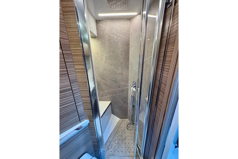 Slide: The Image of Luxurious bathroom in 2026 Cobrey 45 FLY yacht with modern shower design. - 22