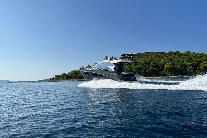 Slide: The Image of Luxury Cobrey 45 FLY yacht cruising on serene waters, 2026 model. - 3