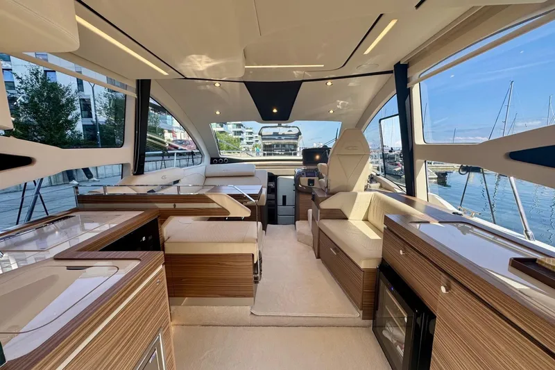 Slide: The Image of Luxurious interior of 2026 Cobrey 45 FLY yacht with modern design and waterfront view. - 7
