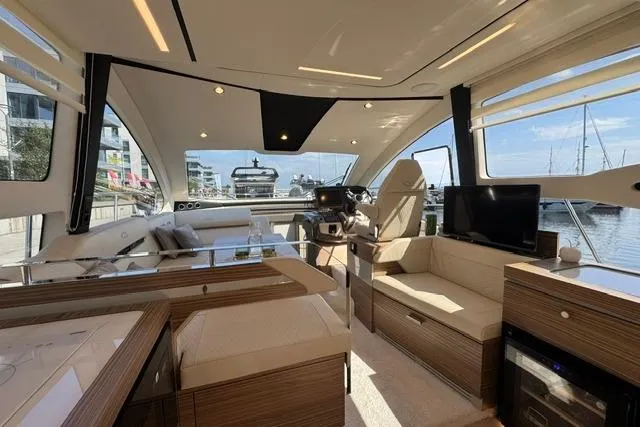 Slide: The Image of Luxurious interior of 2026 Cobrey 45 FLY yacht with modern furnishings and panoramic windows. - 8