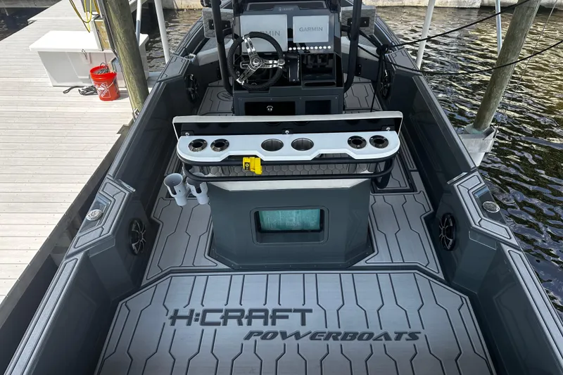 Slide: The Image of 2024 H-Craft 27 CC powerboat interior with modern dashboard and sleek design. - 17