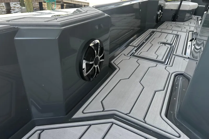 Slide: The Image of 2024 H-Craft 27 CC boat interior with sleek design and modern speaker system. - 18