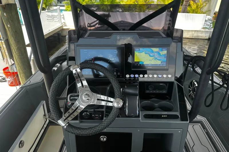 Slide: The Image of 2024 H-Craft 27 CC boat dashboard with advanced navigation and control systems. - 26