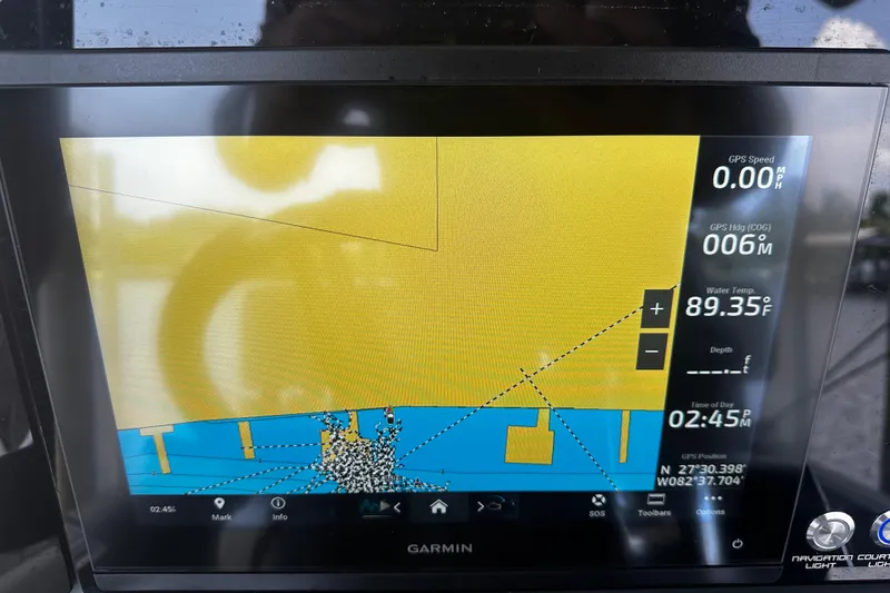 Slide: The Image of Garmin navigation display on 2024 H-Craft 27 CC, showing GPS data and water temperature. - 28