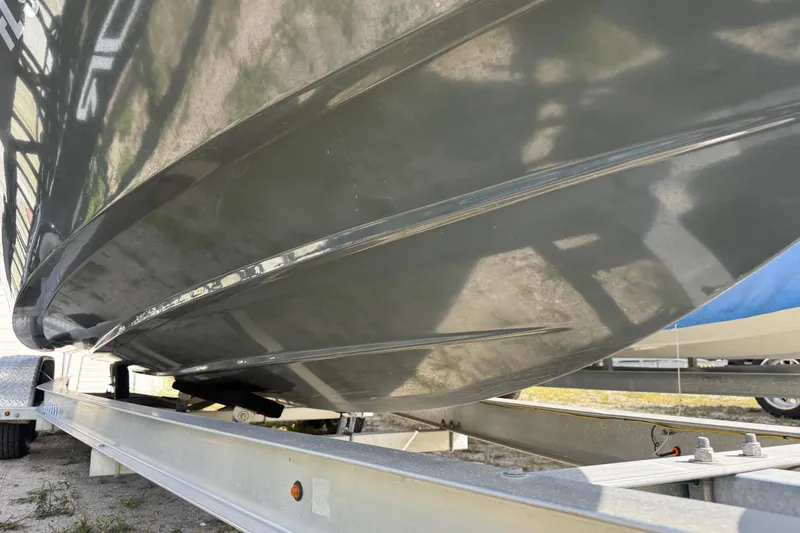 Slide: The Image of 2024 H-Craft 27 CC boat hull on trailer, showcasing sleek design and craftsmanship. - 3