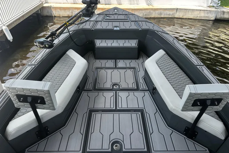 Slide: The Image of 2024 H-Craft 27 CC boat interior with modern seating and sleek design. - 30
