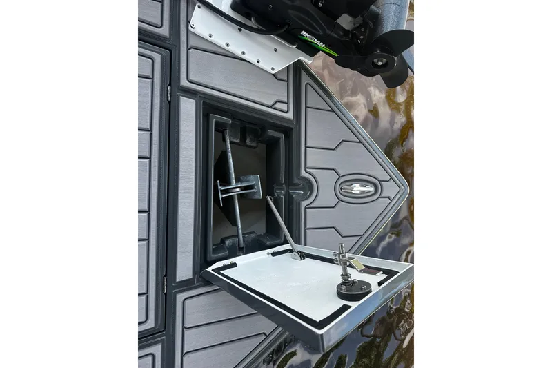 Slide: The Image of 2024 H-Craft 27 CC boat deck with open hatch and motor detail. - 32