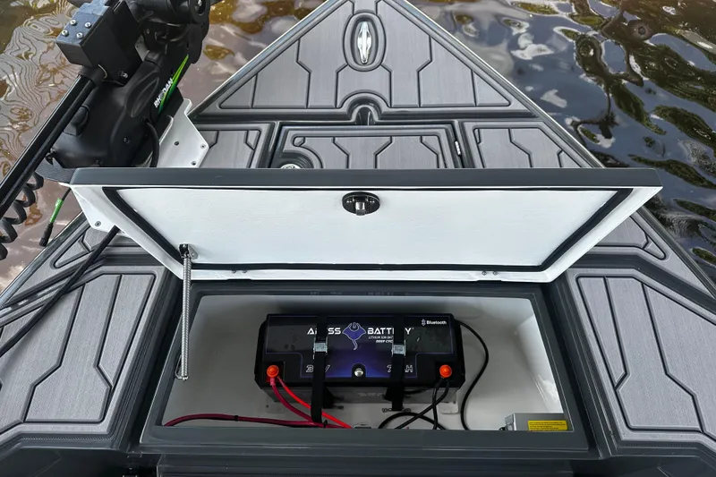 Slide: The Image of 2024 H-Craft 27 CC boat with open battery compartment, featuring advanced lithium battery technology. - 34