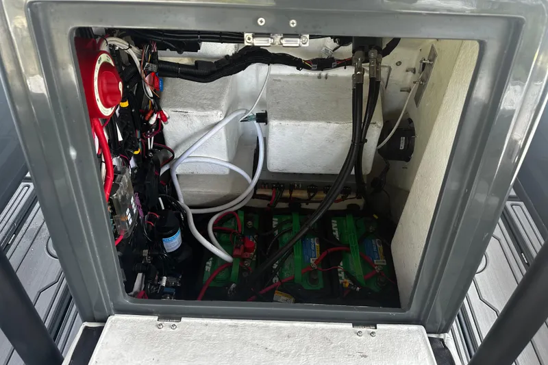 Slide: The Image of 2024 H-Craft 27 CC electrical compartment with wiring and batteries visible. - 36