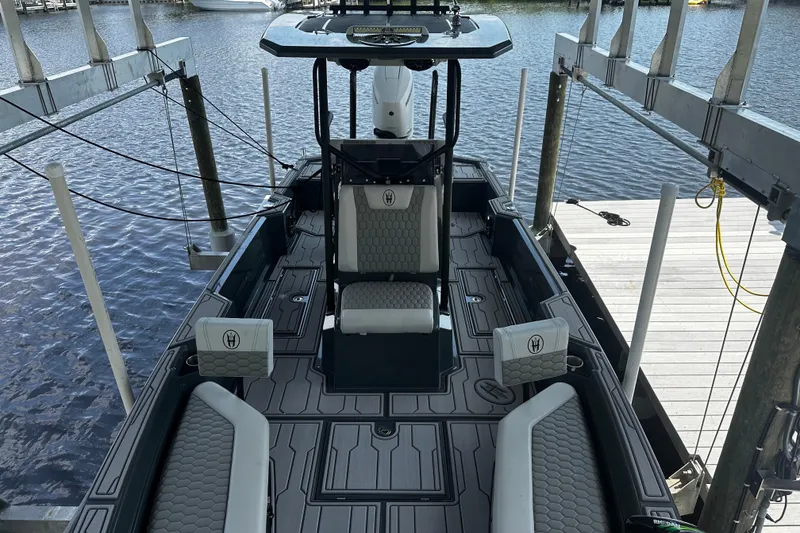 Slide: The Image of 2024 H-Craft 27 CC boat interior with modern seating and sleek design. - 38