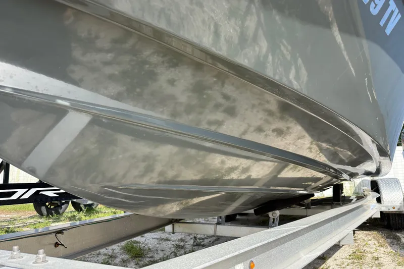 Slide: The Image of 2024 H-Craft 27 CC boat hull on trailer, showcasing sleek design. - 4