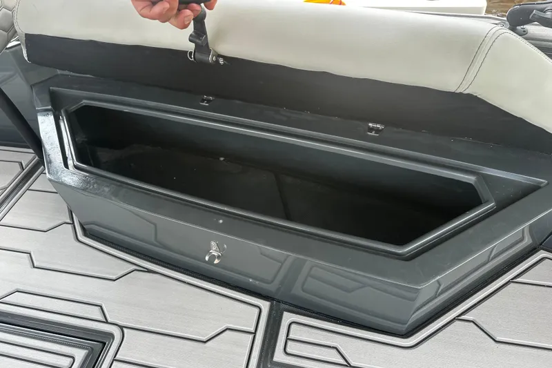 Slide: The Image of Open storage compartment on 2024 H-Craft 27 CC boat with sleek design. - 41