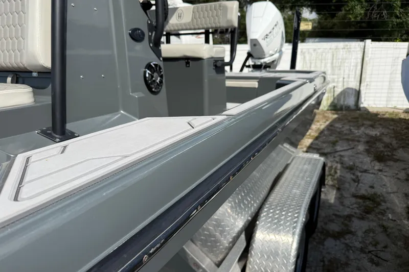 Slide: The Image of 2024 H-Craft 27 CC boat on trailer, showcasing sleek design and modern features. - 8