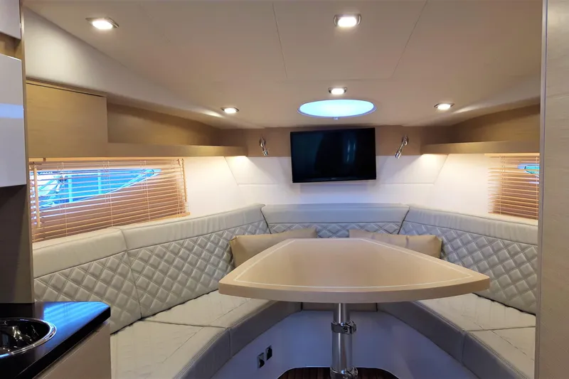 Slide: The Image of Luxurious interior of 2026 Cobrey 33 HT yacht with elegant seating and modern amenities. - 10