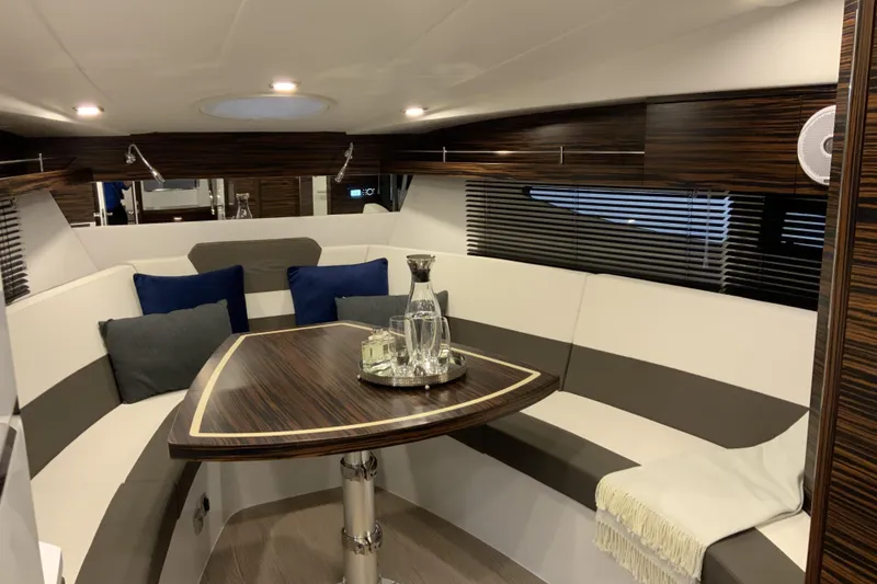 Slide: The Image of Luxurious interior of 2026 Cobrey 33 HT yacht with elegant seating and modern decor. - 8