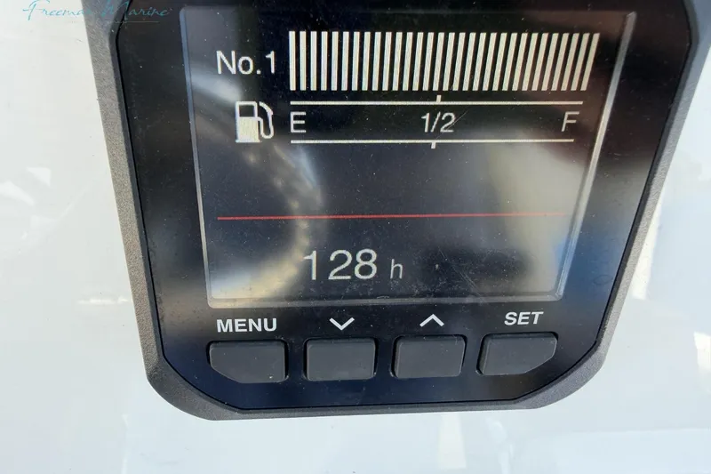 Slide: The Image of Digital display showing 128 hours on a 2020 Tidewater 232 CC Adventure boat. - 14