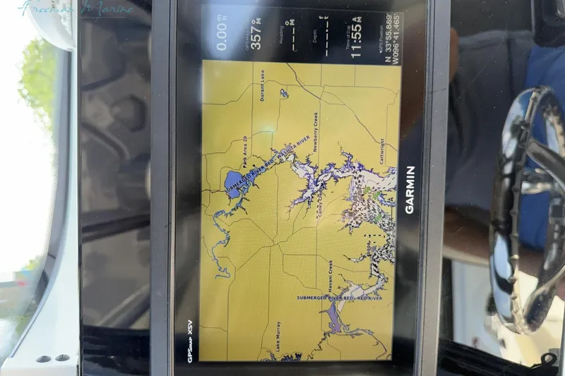 Slide: The Image of Garmin GPS display on 2020 Tidewater 232 CC Adventure boat, showing detailed waterway map. - 15