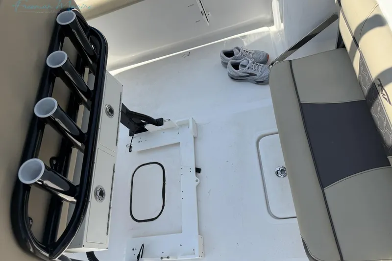 Slide: The Image of Interior of 2020 Tidewater 232 CC Adventure boat with rod holders and seating. - 18