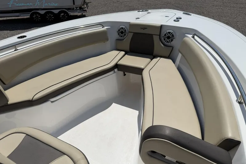 Slide: The Image of 2020 Tidewater 232 CC Adventure boat interior with cushioned seating and speakers. - 3