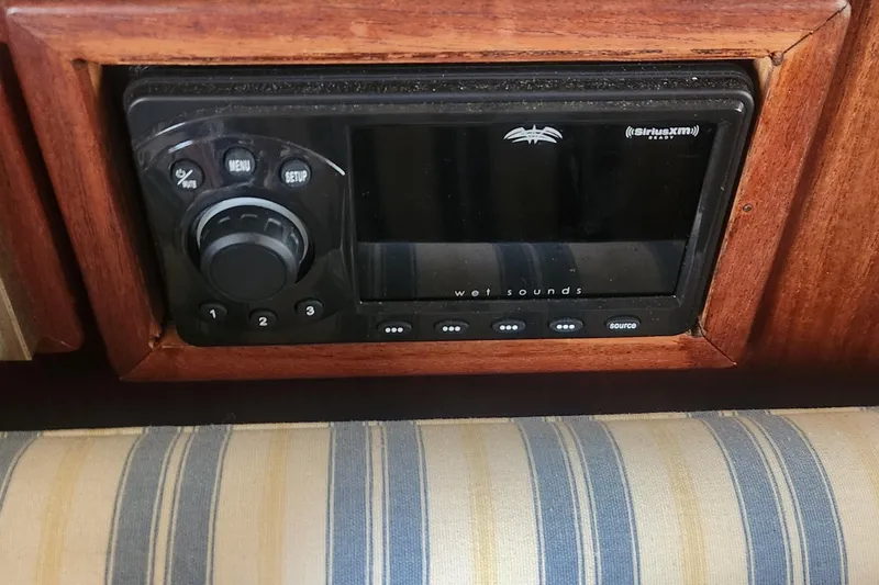 Slide: The Image of Audio system in 1985 Bertram 33 Flybridge Cruiser with SiriusXM and Wet Sounds features. - 27