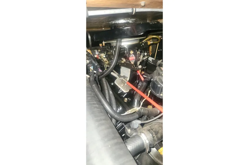 Slide: The Image of Engine compartment of a 1985 Bertram 33 Flybridge Cruiser, showcasing mechanical components. - 30