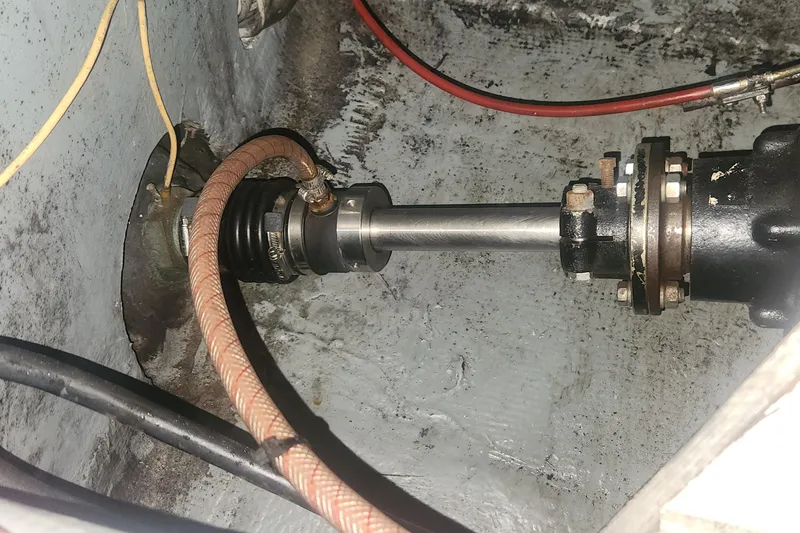 Slide: The Image of Close-up of a 1985 Bertram 33 Flybridge Cruiser's engine shaft and components. - 36