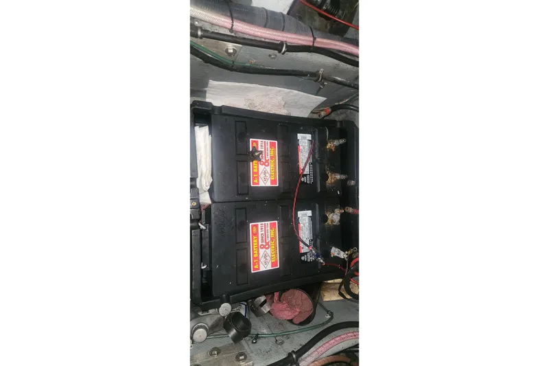 Slide: The Image of Battery compartment of a 1985 Bertram 33 Flybridge Cruiser with wiring connections. - 39