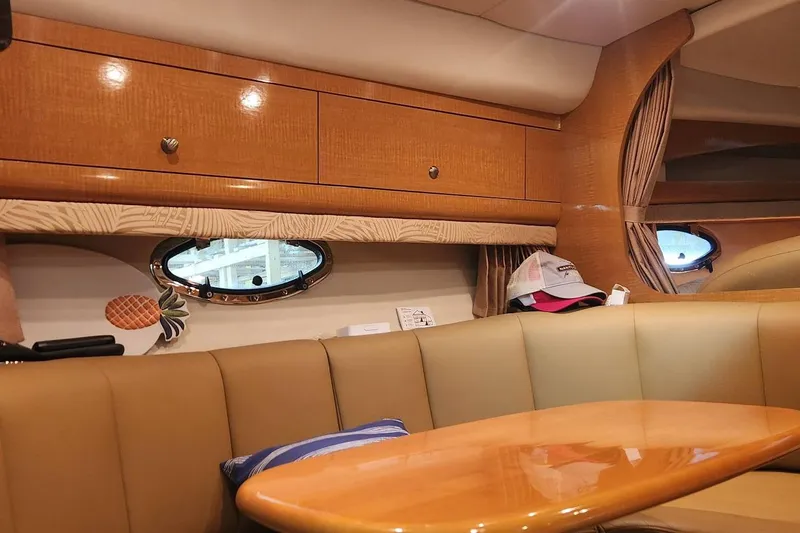 Slide: The Image of Interior of 2006 Chaparral 290 Signature yacht with wood cabinets and leather seating. - 13