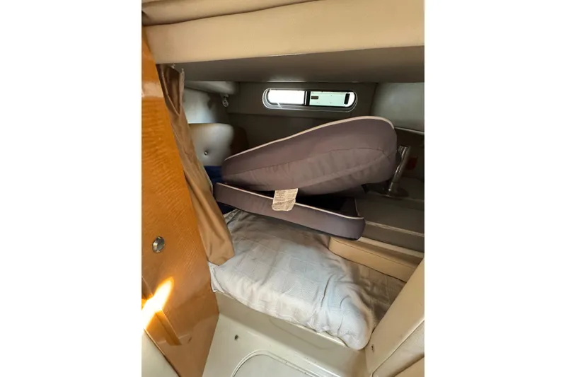 Slide: The Image of 2006 Chaparral 290 Signature cabin interior with cushions and bedding. - 16