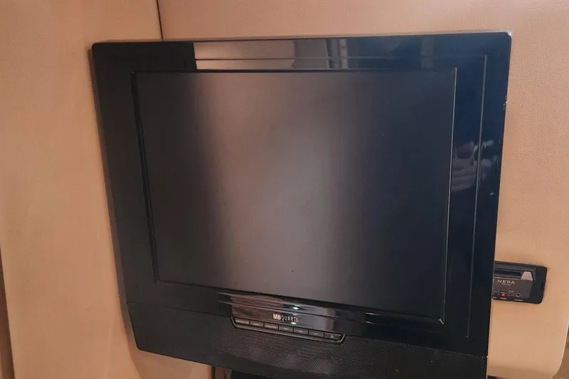 Slide: The Image of Flat-screen TV inside 2006 Chaparral 290 Signature boat cabin. - 17