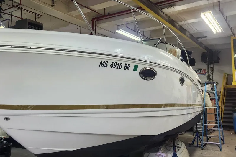 Slide: The Image of 2006 Chaparral 290 Signature boat in a workshop, showing registration number MS 4910 BR. - 4