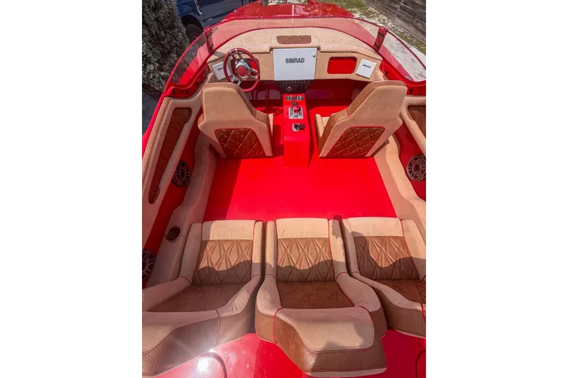 Slide: The Image of Interior of 2025 Bravo Powerboats XP 30, featuring luxurious red and tan seating. - 3