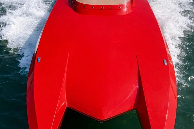 Slide: The Image of Red 2025 Bravo Powerboats XP 30 speeding on water, showcasing sleek design and performance. - 5