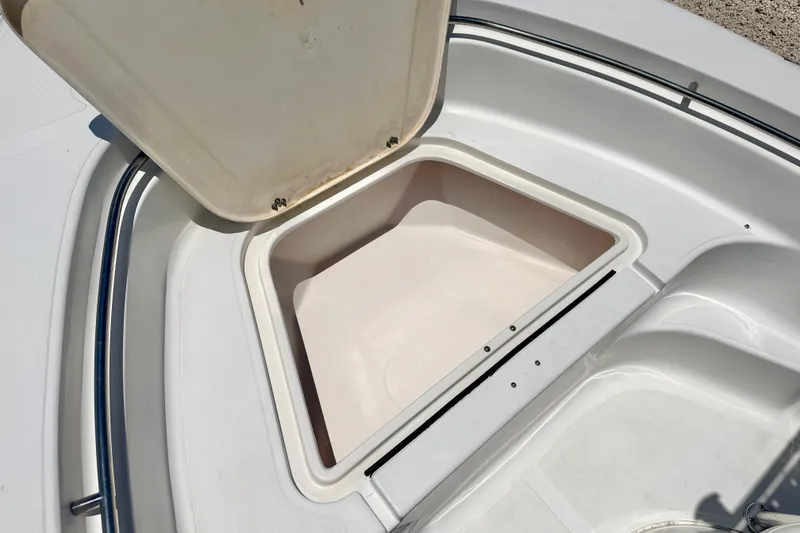 Slide: The Image of Open storage compartment on a 2009 Sea Fox 216 Center Console boat. - 12