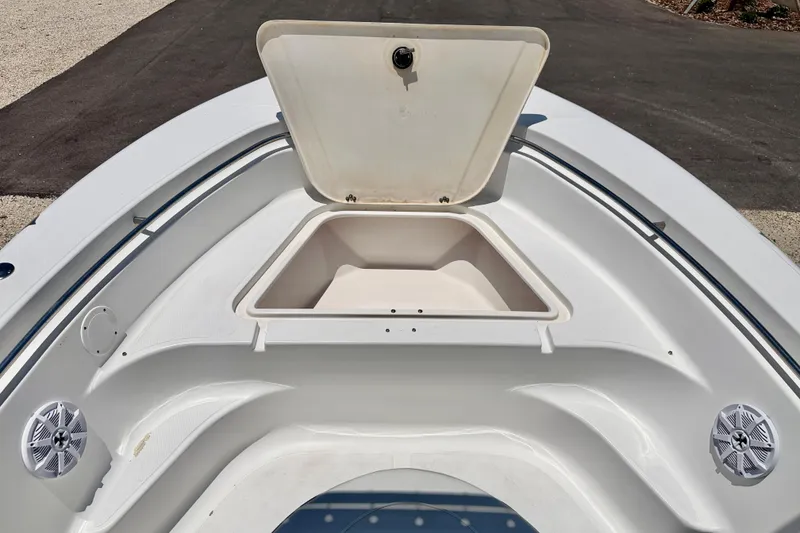 Slide: The Image of 2009 Sea Fox 216 Center Console boat with open storage compartment and speakers. - 13