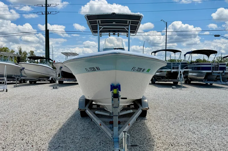 Slide: The Image of 2009 Sea Fox 216 Center Console boat on trailer under blue sky. - 2