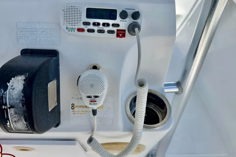 Slide: The Image of Control panel of a 2009 Sea Fox 216 Center Console boat with radio and microphone. - 20